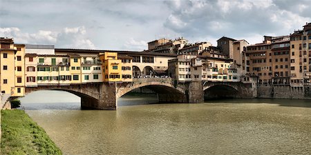 Ponte Vecchio, Medieval bridge crossing the Arno River, now used for art dealers and jewellry stores, Florence, Italy Stock Photo - Premium Royalty-Free, Code: 600-08426552