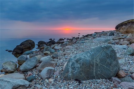 rocky coast and boulder coast - Stony Beach at Sunset, Fyns Hoved, Hindsholm, Kerteminde Municipality, Funen, Baltic Sea, Denmark Stock Photo - Premium Royalty-Free, Code: 600-08519509