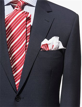 Detail of a dark blue suit jacket with red and white striped necktie and handkerchief and striped shirt Stockbilder - Premium RF Lizenzfrei, Bildnummer: 600-08542882