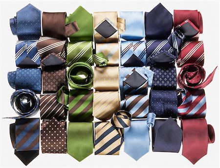 simsearch:614-06044421,k - Group of multi coloured neckties roled-up on white background Foto de stock - Sin royalties Premium, Código: 600-08542915