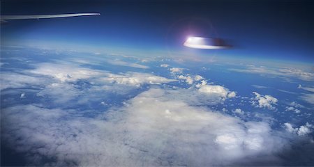 false - View of UFO Outside Airplane Window Stock Photo - Premium Royalty-Free, Code: 600-08683684