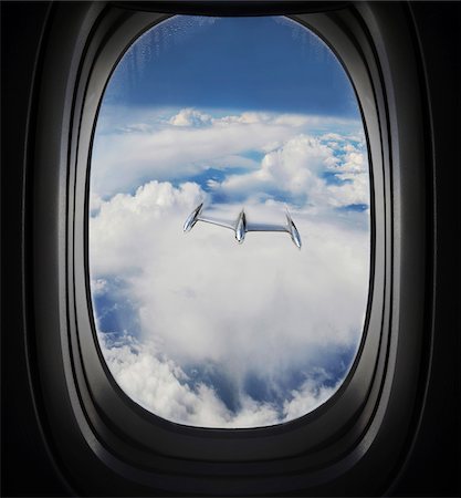 encima de las nubes - View of Approaching UFO from Airplane Window Foto de stock - Sin royalties Premium, Código: 600-08697965