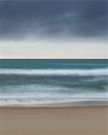 Cloudy sky over the Tyrrhenian Sea and blurred waves crashing the beach at San Felice Circeo in the Province of Latina in Lazio, Italy Stock Photo - Premium Royalty-Free, Code: 600-08765604