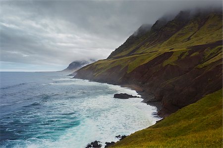 seascapes mountain view - Fog over the cliffs of the Icelandic coast and the Atlantic Ocean in Northeast Iceland Stock Photo - Premium Royalty-Free, Code: 600-08765602
