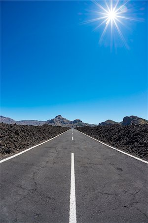 parque nacional del teide - Road through Lava Field with Sun in Parque Nacional del Teide, Tenerife, Canary Islands, Spain Stock Photo - Premium Royalty-Free, Code: 600-08783068