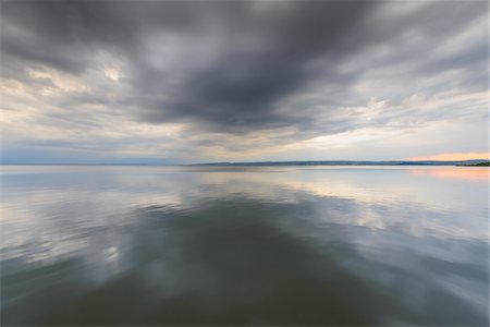 simsearch:600-08783088,k - Clouds Reflecting in Lake Neusiedl at Sunset at Weiden am See, Burgenland, Austria Stock Photo - Premium Royalty-Free, Code: 600-08783101