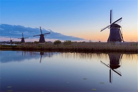 simsearch:6119-08541937,k - Windmills at Dawn, Kinderdijk, South Holland, Netherlands Foto de stock - Royalty Free Premium, Número: 600-08865321