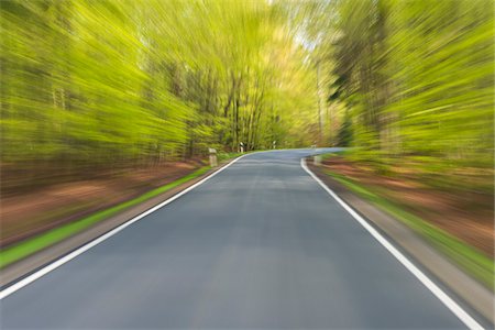 fast forward - Driving along paved road through the spring forest at Amorbach in Odenwald, in Lower Franconia, Bavaria, Germany Stock Photo - Premium Royalty-Free, Code: 600-08916148