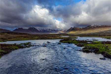streaming (flow of movement) - River in moor landscape with cloudy sky and mountains in the background at Rannoch Moor in Scotland, United Kingdom Stock Photo - Premium Royalty-Free, Code: 600-08973434