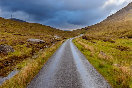 simsearch:600-08973411,k - Winding road in the highlands with cloudy sky at Glen Coe in Scotland, United Kingdom Stock Photo - Premium Royalty-Free, Code: 600-08973450