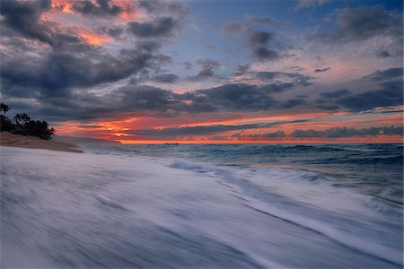 simsearch:600-06438868,k - Sunset and surf on the Pacific Ocean at Sunset Beach on Oahu, Hawaii, USA Stock Photo - Premium Royalty-Free, Code: 600-08986238