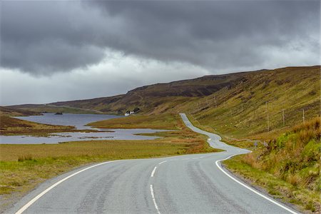 simsearch:600-08986298,k - Winding coastal road and typical Scottish landscape on the Trotternish Peninsula on the Isle of Skye in Scotland, United Kingdom Stock Photo - Premium Royalty-Free, Code: 600-08986476