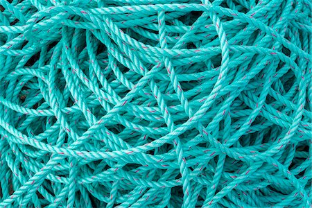 simsearch:600-07784396,k - Cloae-up of a pile of turquoise rope in the harbor at Seahouses in Northumberland, Englans, United Kingdom Photographie de stock - Premium Libres de Droits, Code: 600-09013891