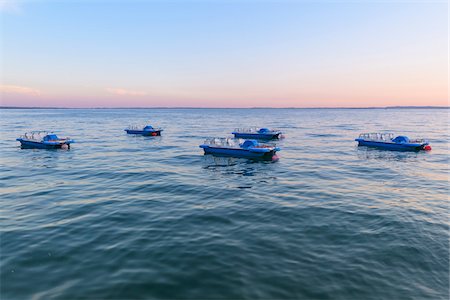 simsearch:600-08783083,k - Lake Garda (Lago di Garda) with anchored pedal boats at dusk in Garda in Veneto, Italy Stock Photo - Premium Royalty-Free, Code: 600-09022391