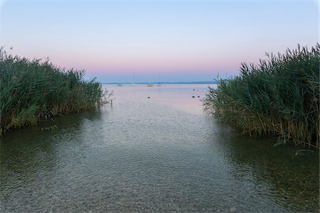simsearch:600-09022436,k - View of Lake Garda (Lago di Garda) through reeds at dawn in Bardolino in Veneto, Italy Stock Photo - Premium Royalty-Free, Code: 600-09022412