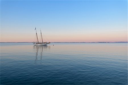 pastel water not people - Two masted sailboat anchored on Lake Garda (Lago di Garda) at dawn at Bardolinoin Veneto, Italy Stock Photo - Premium Royalty-Free, Code: 600-09022424