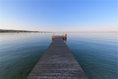 dock lake perspective - Wooden jetty on Lake Garda (Lago di Garda) in the morning at Bardolino in Veneto, Italy Stock Photo - Premium Royalty-Free, Code: 600-09022433