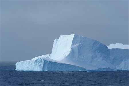 remote power - Part of an iceberg reflecting the light on an overcast day in the Antarctic Sound at the Antarctic Peninsula, Antarctica Stock Photo - Premium Royalty-Free, Code: 600-09052806