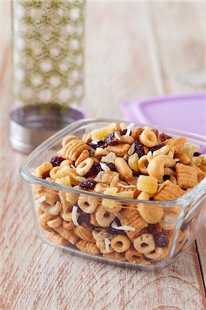Healthy snack mix in a portable glass storage container with a water bottle Stock Photo - Premium Royalty-Free, Code: 600-09119423