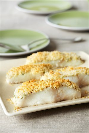 Panko crusted white fish pieces on a serving platter Stock Photo - Premium Royalty-Free, Code: 600-09119447