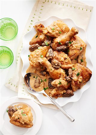 simsearch:600-08002141,k - Chicken with morel mushroom sauce served on a fancy white platter with serving spoon Stock Photo - Premium Royalty-Free, Code: 600-09155564