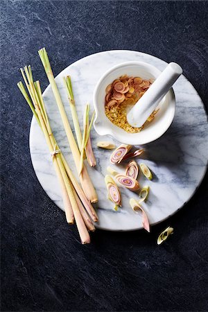 food, dark background - Lemongrass still life on a marble cutting board with mortar and pestle Stock Photo - Premium Royalty-Free, Code: 600-09155575