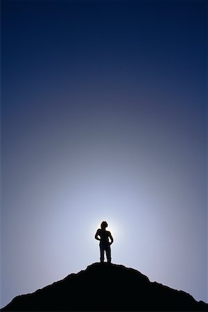 reaching the top - Silhouette of Man Standing on Mountain Top Stock Photo - Premium Royalty-Free, Code: 600-00013381