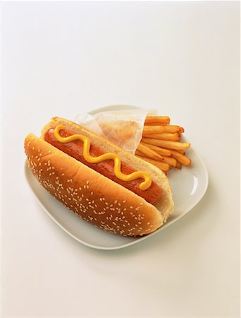Hotdog with French Fries Stock Photo - Premium Royalty-Free, Code: 600-00034134