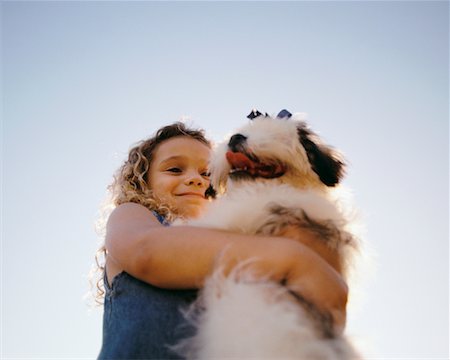 simsearch:700-00814363,k - Girl Hugging Dog Outdoors Foto de stock - Sin royalties Premium, Código: 600-00037255