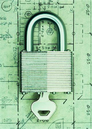 Key in Padlock on Floor Plans Stock Photo - Premium Royalty-Free, Code: 600-00055192