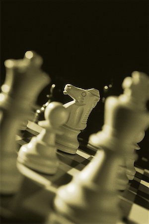 simsearch:700-00031145,k - Close-Up of Chess Pieces on Chess Board Fotografie stock - Premium Royalty-Free, Codice: 600-00059375