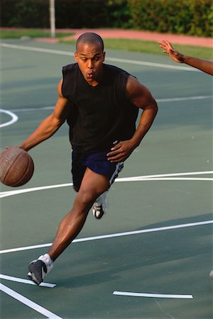 simsearch:700-00036910,k - Man Dribbling Basketball Outdoors Foto de stock - Sin royalties Premium, Código: 600-00064604