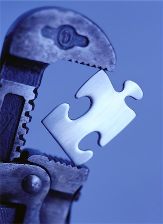 puzzle concept not person - Close-Up of Pipe Wrench and Puzzle Piece Stock Photo - Premium Royalty-Free, Code: 600-00065195