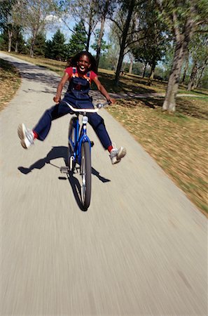simsearch:600-01614199,k - Girl Riding Bicycle on Path Stock Photo - Premium Royalty-Free, Code: 600-00069308
