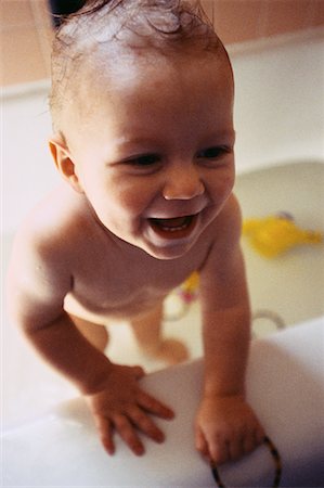 Baby Standing in Bathtub Stock Photo - Premium Royalty-Free, Code: 600-00069782