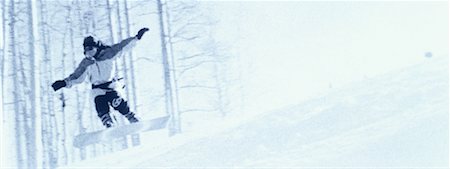 snowboarder (female) - Snowboarder Jumping over Hill Stock Photo - Premium Royalty-Free, Code: 600-00061869