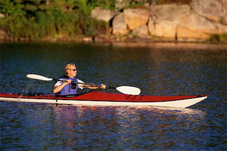 Man Kayaking on Lake, Haliburton, Ontario, Canada Stock Photo - Premium Royalty-Free, Code: 600-00071232