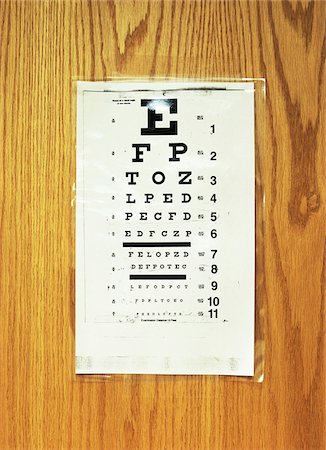 eye exam - Eye Chart Taped to Door Stock Photo - Premium Royalty-Free, Code: 600-00085702