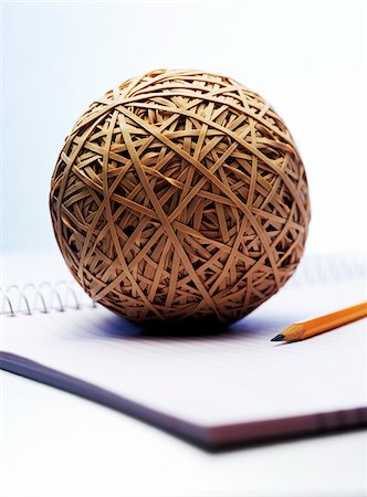 pencil and object - Rubber Band Ball, Pencil, and Notebook Stock Photo - Premium Royalty-Free, Code: 600-00165687