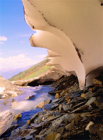 Snow Remnant and Runoff, Middle Mountain, Northern Rockies British Columbia, Canada Stock Photo - Premium Royalty-Free, Code: 600-00174021