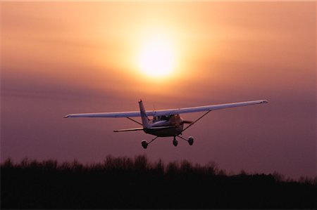 Plane Taking Off at Sunset Stock Photo - Premium Royalty-Free, Code: 600-00172201