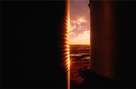 Grain Storage Bin at Sunset Alberta, Canada Stock Photo - Premium Royalty-Free, Code: 600-00172371