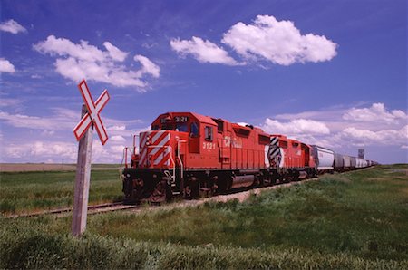 simsearch:600-00174108,k - Train at Crossing, Saskatchewan, Canada Stock Photo - Premium Royalty-Free, Code: 600-00173821