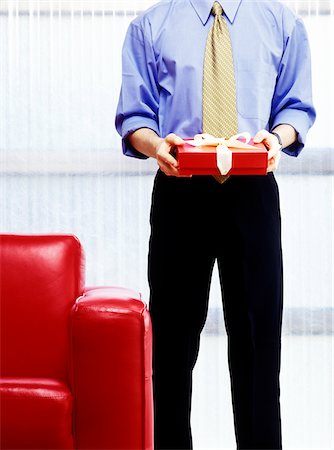 picture of man with red bow - Businessman with a Gift Stock Photo - Premium Royalty-Free, Code: 600-00343143