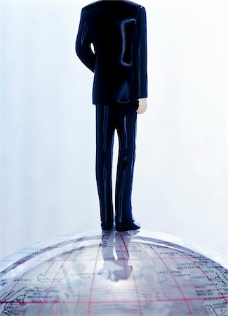 Figurine of Businessman Standing on Top of the World Stock Photo - Premium Royalty-Free, Code: 600-00507150