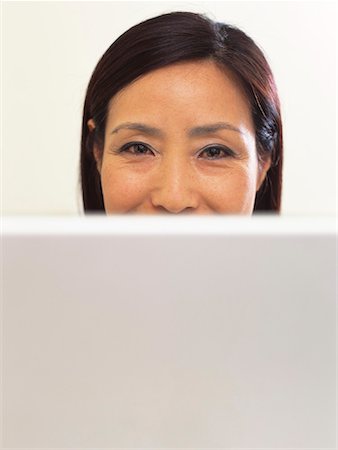 Portrait of Woman With Laptop Computer Stock Photo - Premium Royalty-Free, Code: 600-00796266