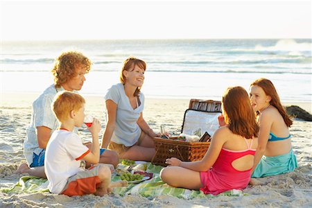 family eating on the beach - Family Having Picnic Stock Photo - Premium Royalty-Free, Code: 600-00796475