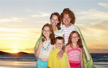 preteen boys in a towel - Portrait of Family on the Beach Stock Photo - Premium Royalty-Free, Code: 600-00796486