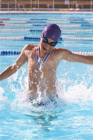 swimming cap boys - Boy Cheering in Swimming Pool Stock Photo - Premium Royalty-Free, Code: 600-00814605