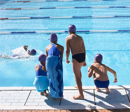 rear view of a boy bending over - Swimmers by Pool Stock Photo - Premium Royalty-Free, Code: 600-00814613